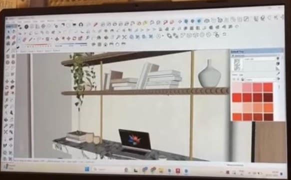 SketchUp model of the desk wall on a monitor, showing the shelves, the marble desk and a colour palette panel.